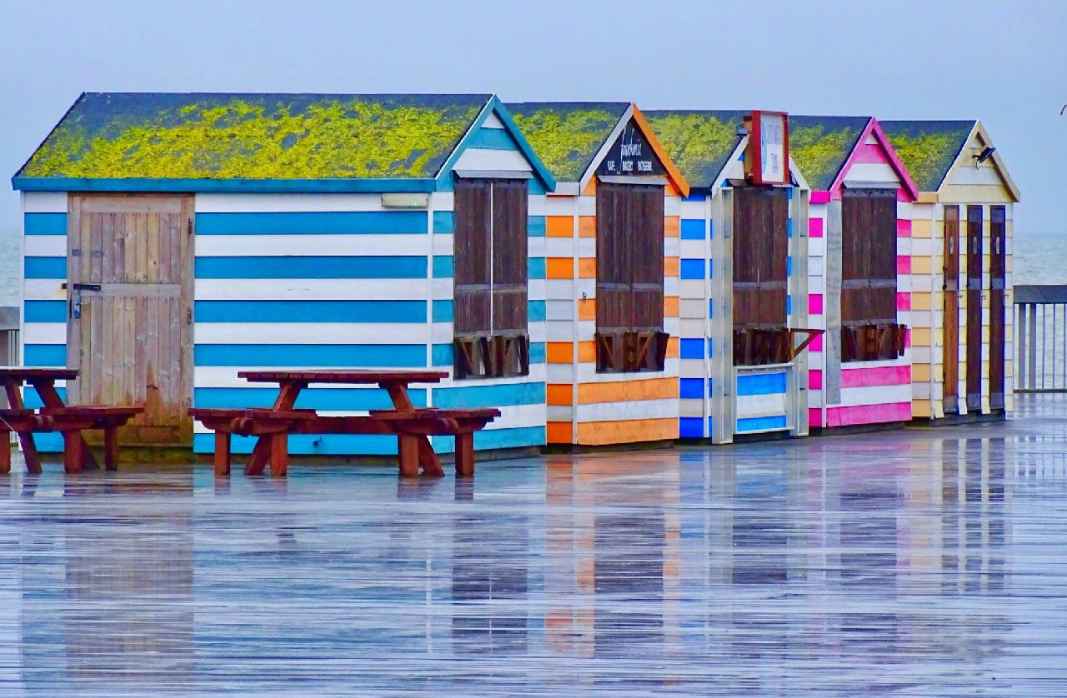 Hastings beach huts in the rain