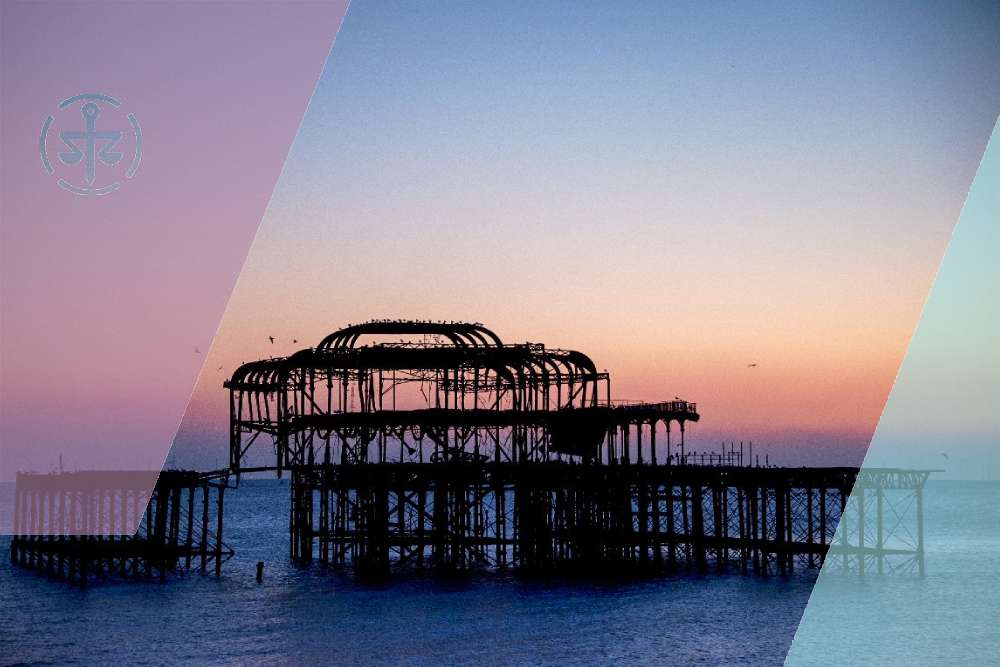 Brighton's West Pier at sunset, viewed from the seafront